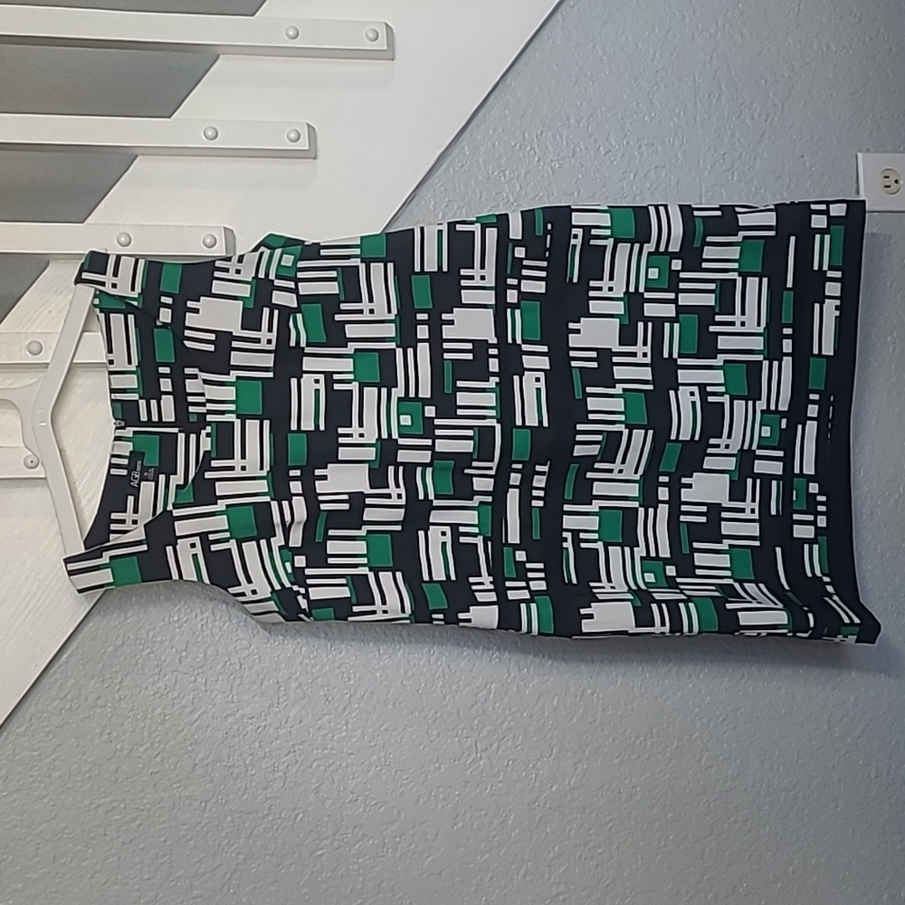 AGB green, black, and white geometric print dress.